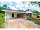 Charming single story brick home with a covered carport and manicured landscaping at 6213 Cherry Ln, Douglasville, GA 30134