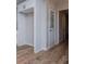 Kitchen area featuring open shelving and hardwood style floors and plenty of light at 6213 Cherry Ln, Douglasville, GA 30134