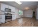 Kitchen featuring white cabinets, stainless appliances, and granite countertops at 6213 Cherry Ln, Douglasville, GA 30134