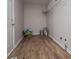Laundry room with modern flooring and neutral paint and laundry hookups at 6213 Cherry Ln, Douglasville, GA 30134