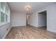 Inviting living room with ample natural light, and stylish wood flooring at 6213 Cherry Ln, Douglasville, GA 30134