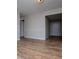 Open living room featuring wood flooring, neutral paint, and trim details at 6213 Cherry Ln, Douglasville, GA 30134