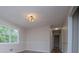 Bright living room with decorative lighting, neutral walls, and wood flooring at 6213 Cherry Ln, Douglasville, GA 30134