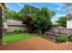 Private backyard retreat featuring a deck, mature trees, and raised garden beds at 628 Home Se Ave, Atlanta, GA 30312