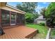 Backyard featuring a screened-in porch and patio stepping down to a brick walkway and green space at 628 Home Se Ave, Atlanta, GA 30312