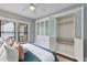 Bedroom with closet including custom storage, a ceiling fan, and natural light at 628 Home Se Ave, Atlanta, GA 30312