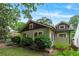 Charming craftsman-style home with a well-maintained lawn and lush landscaping at 628 Home Se Ave, Atlanta, GA 30312