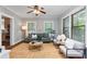 Bright living room featuring hardwood floors, natural light, and comfortable seating at 628 Home Se Ave, Atlanta, GA 30312