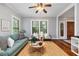 Bright living room featuring hardwood floors, natural light, and comfortable seating at 628 Home Se Ave, Atlanta, GA 30312