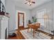 Stylish home office area with hardwood floors, a decorative fireplace, and lots of light at 628 Home Se Ave, Atlanta, GA 30312