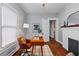 Charming home office space featuring hardwood floors, a fireplace, and a decorative rug at 628 Home Se Ave, Atlanta, GA 30312