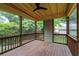 Covered patio featuring wood flooring and railing surrounded by beautiful foliage at 628 Home Se Ave, Atlanta, GA 30312