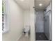 Bathroom featuring modern fixtures, toilet, and enclosed shower at 821 Springvalley Dr, Forest Park, GA 30297