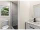 Updated bathroom featuring modern vanity, and a sleek tiled shower at 821 Springvalley Dr, Forest Park, GA 30297