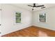 Cozy bedroom with hardwood floors and a ceiling fan for added comfort at 821 Springvalley Dr, Forest Park, GA 30297