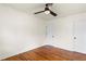 Bedroom with hardwood floors, ceiling fan, and neutral walls, creating a serene ambiance at 821 Springvalley Dr, Forest Park, GA 30297