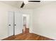 Bright bedroom featuring hardwood floors and a ceiling fan for added comfort at 821 Springvalley Dr, Forest Park, GA 30297