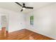 Bright bedroom with hardwood floors, ceiling fan and two access doors for ease of passage at 821 Springvalley Dr, Forest Park, GA 30297