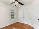Cozy bedroom with hardwood flooring, ceiling fan, and bright window at 821 Springvalley Dr, Forest Park, GA 30297