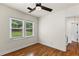 Bright bedroom featuring wood floors and natural light from backyard view at 821 Springvalley Dr, Forest Park, GA 30297