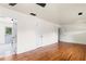 Spacious living room with hardwood floors, neutral paint, and multiple doorways at 821 Springvalley Dr, Forest Park, GA 30297
