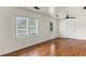 Spacious living room featuring hardwood floors and ample natural light at 821 Springvalley Dr, Forest Park, GA 30297