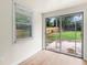 Bright room featuring tile flooring and a sliding glass door that leads to the backyard at 821 Springvalley Dr, Forest Park, GA 30297