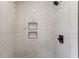 New shower stall with stylish tile work and built-in shower caddies at 821 Springvalley Dr, Forest Park, GA 30297