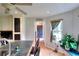 Bright kitchen featuring an island with bar seating and modern lighting, and a view into the living space at 1809 Brandi Ln, Loganville, GA 30052
