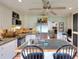 Bright kitchen featuring an island with bar seating, stainless steel appliances, and a view into the living space at 1809 Brandi Ln, Loganville, GA 30052