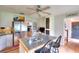 Bright kitchen featuring an island with bar seating, stainless steel appliances, and a view into the living space at 1809 Brandi Ln, Loganville, GA 30052