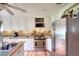 Bright eat-in kitchen features granite countertops, stainless appliances, and modern lighting at 1809 Brandi Ln, Loganville, GA 30052