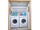 Convenient laundry room area equipped with front load washer and dryer at 1809 Brandi Ln, Loganville, GA 30052