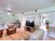 Bright living room with leather seating and access to kitchen at 1809 Brandi Ln, Loganville, GA 30052