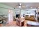 Cozy living room featuring hardwood floors, a fireplace, and comfortable leather recliners at 1809 Brandi Ln, Loganville, GA 30052