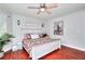 Spacious main bedroom with hardwood floors, natural light, and stylish decor at 1809 Brandi Ln, Loganville, GA 30052