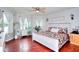 Spacious main bedroom with hardwood floors, natural light, and comfortable furnishings at 1809 Brandi Ln, Loganville, GA 30052