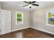 Bedroom with two windows, ceiling fan, and hardwood floors at 2288 Scotty Cir, Decatur, GA 30032