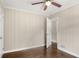 Bright bedroom featuring paneled walls, hardwood floors and a ceiling fan at 2288 Scotty Cir, Decatur, GA 30032
