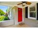 Inviting front porch featuring a bright red door, and neutral tones at 2288 Scotty Cir, Decatur, GA 30032