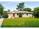 Charming home with a well-maintained lawn and inviting red front door at 2288 Scotty Cir, Decatur, GA 30032