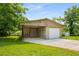 Detached garage and carport with a concrete driveway at 2288 Scotty Cir, Decatur, GA 30032