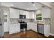 Updated kitchen with stainless steel appliances, granite countertops, and modern backsplash at 2288 Scotty Cir, Decatur, GA 30032