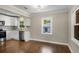 Open-concept kitchen with white cabinets, stainless steel appliances, and hardwood floors at 2288 Scotty Cir, Decatur, GA 30032