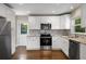 Updated kitchen with stainless steel appliances, granite countertops, and modern backsplash at 2288 Scotty Cir, Decatur, GA 30032