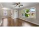 Spacious living room featuring hardwood floors, neutral walls and large windows at 2288 Scotty Cir, Decatur, GA 30032