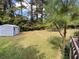 Expansive backyard featuring a storage shed, with ample space for outdoor activities and gardening at 3098 Henderson Mill Rd, Atlanta, GA 30341