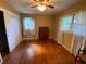 Bedroom featuring hardwood floors, neutral walls, two windows, and a built in dresser at 3098 Henderson Mill Rd, Atlanta, GA 30341