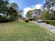 Traditional brick ranch home with a carport and mature landscaping in a quiet neighborhood at 3098 Henderson Mill Rd, Atlanta, GA 30341