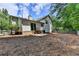 View of the back of a house featuring a porch and picket fence in backyard at 4398 Stonebridge Ct, Duluth, GA 30096